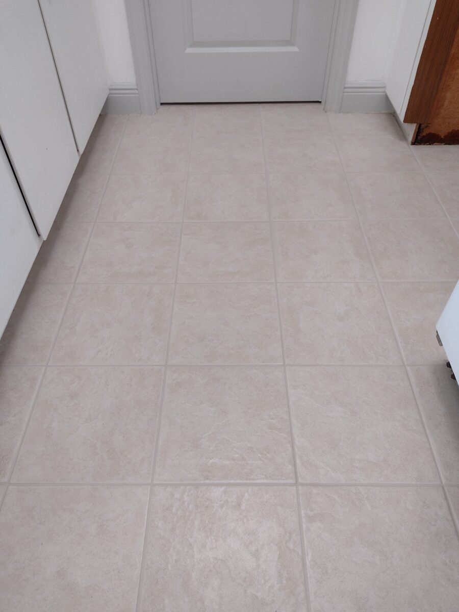 Entryway tile floor after color sealing