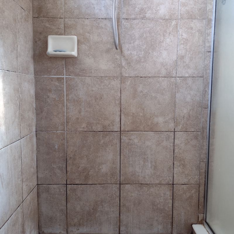 Shower wall grout before cleaning and resealing